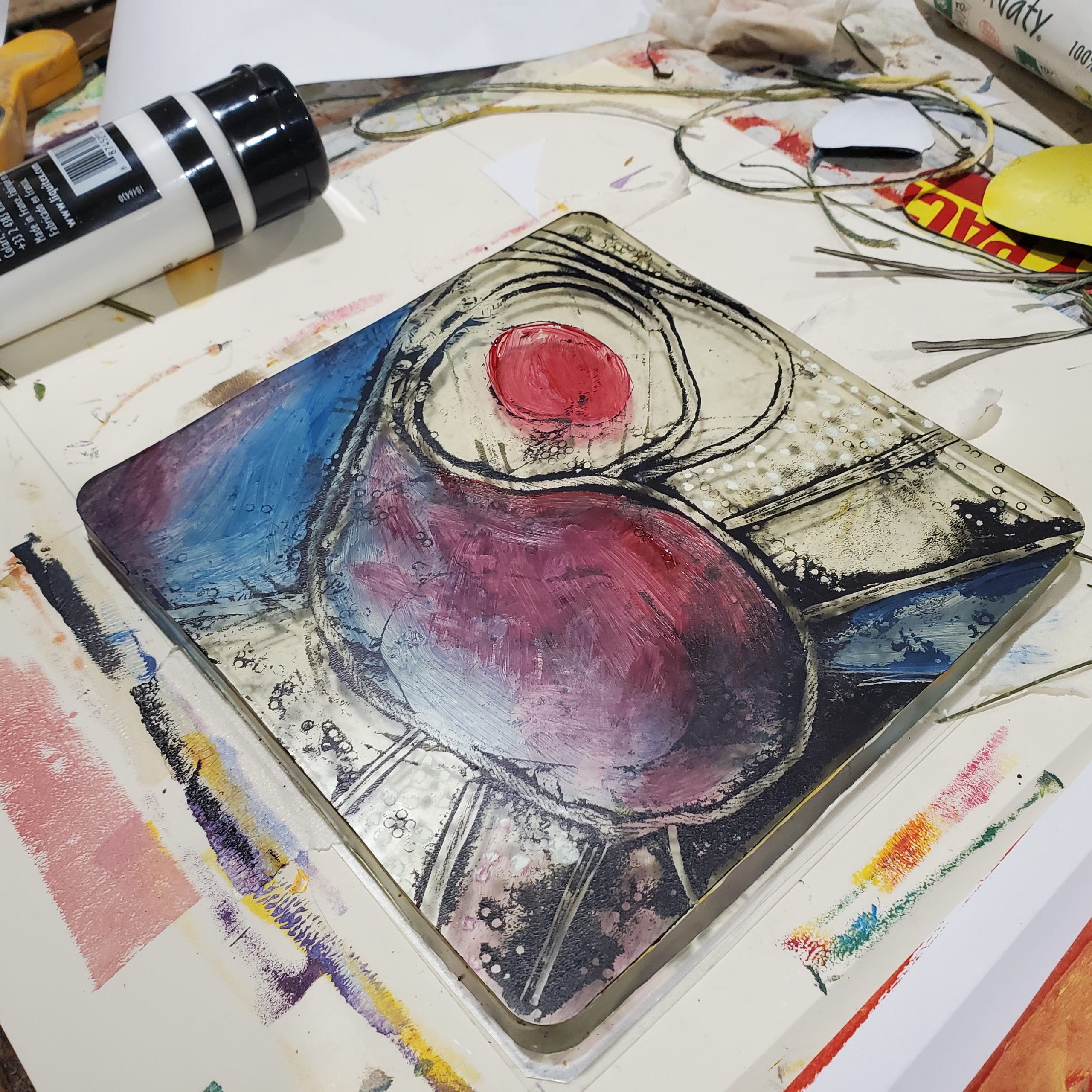 Gel plate with paint on it ready to pull the print